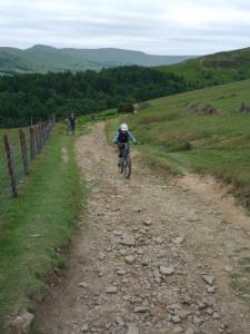 Anne climbing the loose, rocky track from Jaggers Clough to Hope Cross.